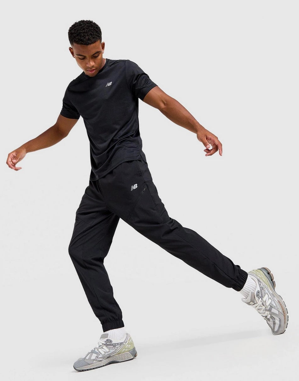 Pantalon New Balance Homme – Sport Woven Noir Léger Confort
