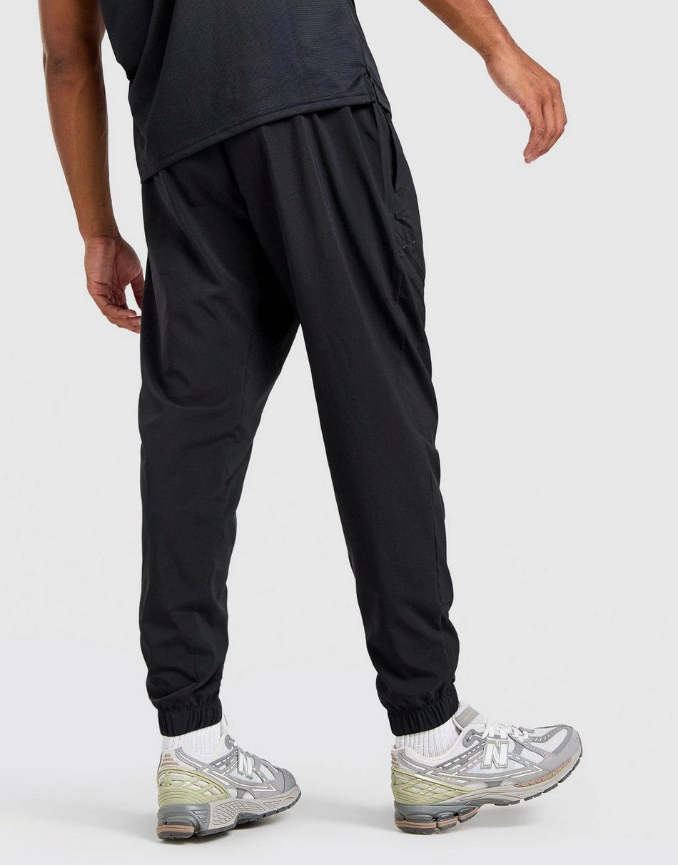 Pantalon New Balance Homme – Sport Woven Noir Léger Confort